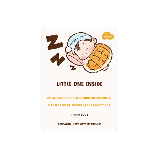 Bowwloo Little One Inside magnetic door sign with Baby Bolo tucked up in a nightcap